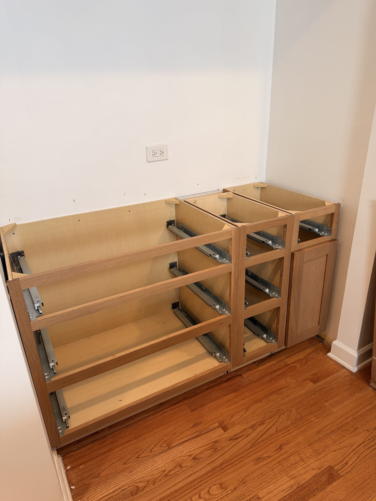 After: cabinet base boxes set in place with soft-close drawer slides