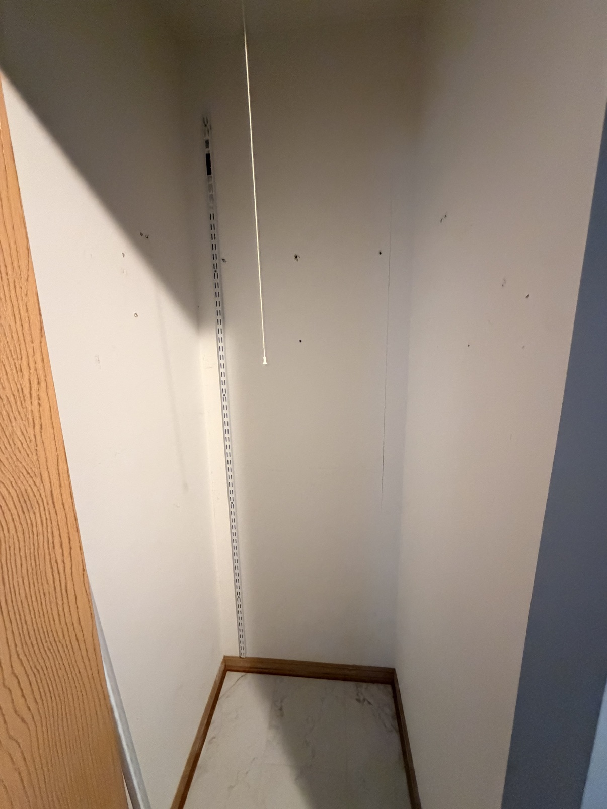 Before: empty closet before shelving installation