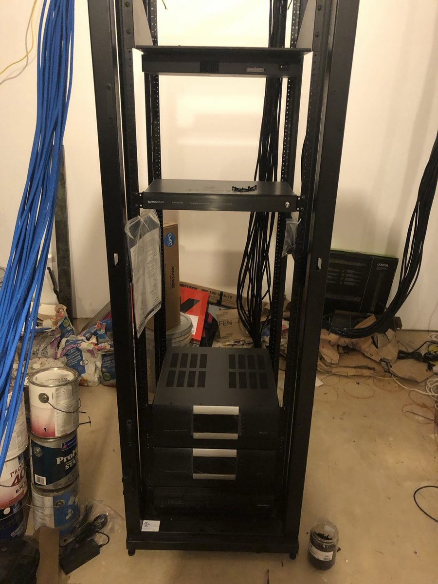 Equipment rack build with stacked audio components and cabling