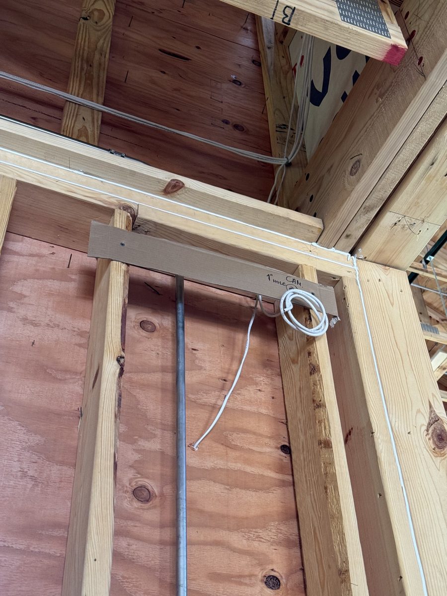 Low-voltage cable pre-wiring through open wall framing